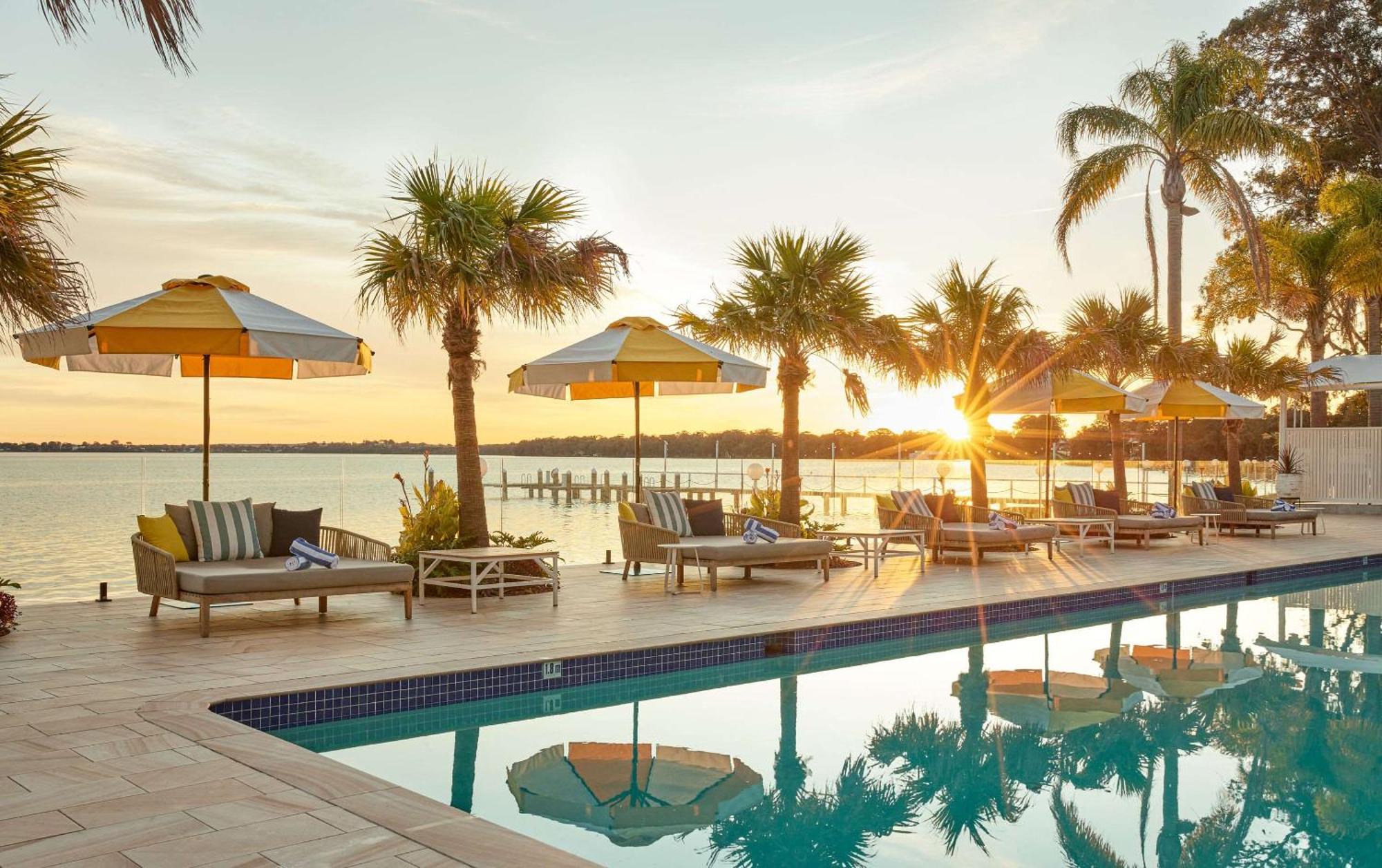 The Beachcomber Hotel & Resort, Ascend Hotel Collection Toukley Exterior photo Sunset at the pool at the Marker Key West Hotel
