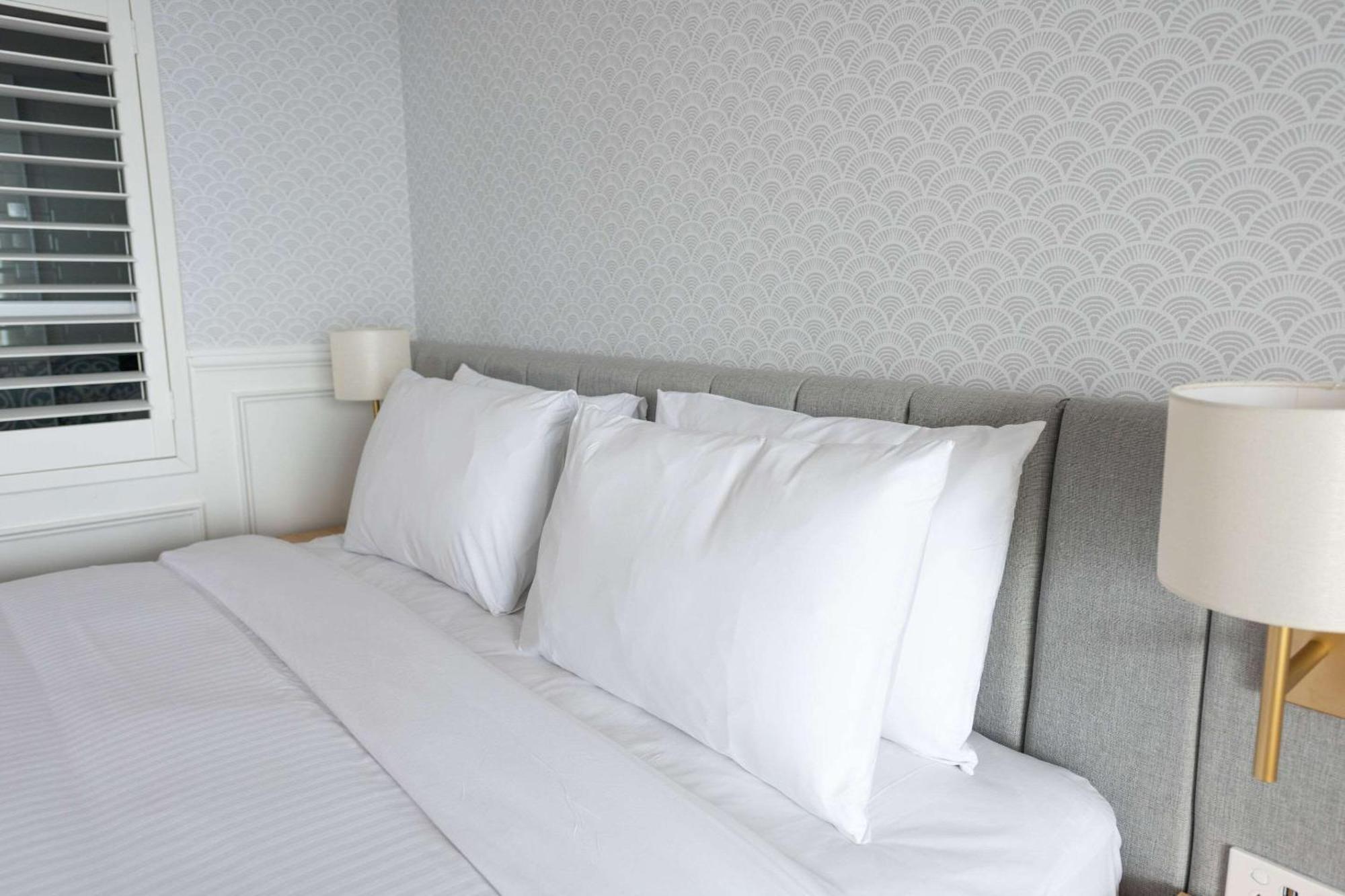 The Beachcomber Hotel & Resort, Ascend Hotel Collection Toukley Exterior photo Pillows on a bed
